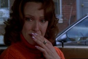 Scene in The Sixth Sense. Lynn Sear, played by Toni Colette, is in the car talking with her son. She's covering her mouth and is in tears as she learns the truth about her mother.