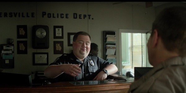 The ending scene of the movie Richard Jewell. Richard became a police officer and his lawyer is visiting him.